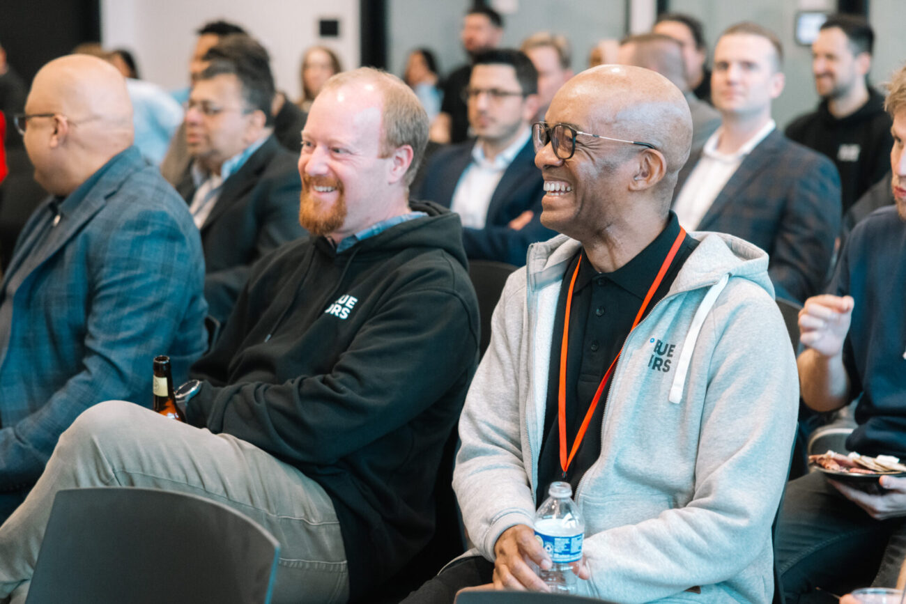 Audience smiling at the Bluefors Lab opening event.