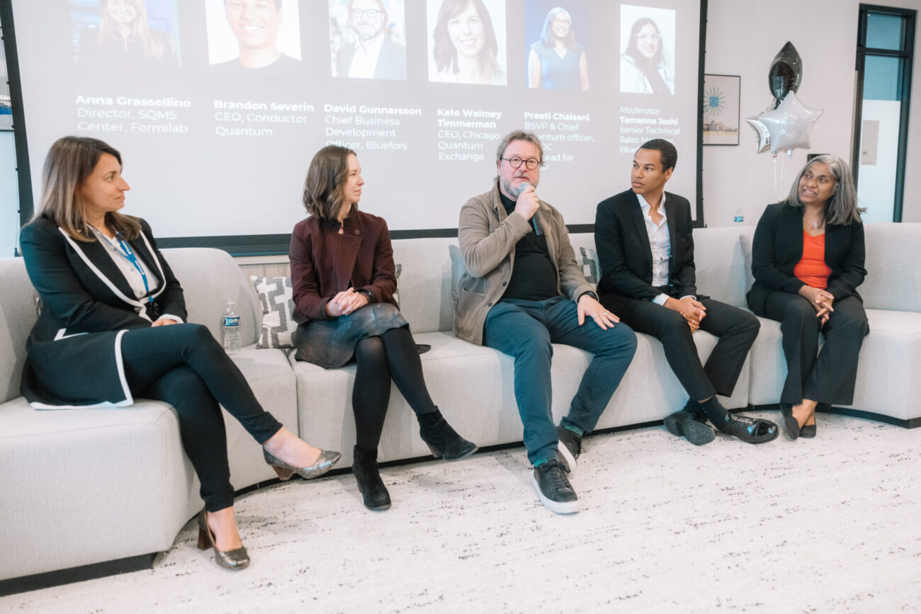 Panelists talking at the Bluefors Lab opening event.