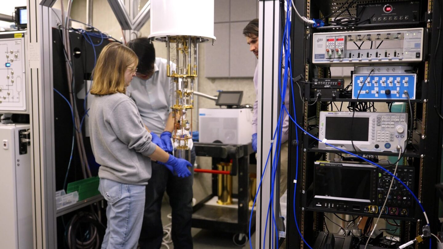 Students working with a cryostat